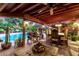 Charming covered patio overlooking the pool, featuring comfortable seating and a dining area perfect for outdoor entertaining at 6101 E Thunderbird Rd, Scottsdale, AZ 85254