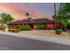 Inviting single-story home with lush greenery, a desert-friendly landscape, and a well-maintained facade at 6101 E Thunderbird Rd, Scottsdale, AZ 85254