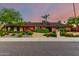 Charming single-story home boasting vibrant landscaping, mature trees, and a welcoming entrance at 6101 E Thunderbird Rd, Scottsdale, AZ 85254