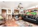 Inviting living room features tile flooring, stone accents, and a comfortable seating arrangement at 6101 E Thunderbird Rd, Scottsdale, AZ 85254