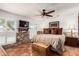 Spacious main bedroom features a ceiling fan, wood accents, and natural light through shuttered windows at 6101 E Thunderbird Rd, Scottsdale, AZ 85254