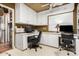 Functional office space featuring ample storage, built-in desks, and natural light at 6101 E Thunderbird Rd, Scottsdale, AZ 85254