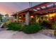 Charming outdoor patio with brick columns, lush plants, and decorative lighting for relaxed evenings at 6101 E Thunderbird Rd, Scottsdale, AZ 85254