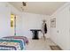 Cozy bedroom featuring a bed, table, and coat rack at 6237 E Boston St, Mesa, AZ 85205