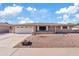 Charming single-story home with a well-maintained yard and inviting curb appeal, showcasing Arizona desert landscaping at 6237 E Boston St, Mesa, AZ 85205