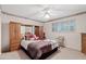 Comfortable primary bedroom with floral accents and ample storage at 6237 E Boston St, Mesa, AZ 85205