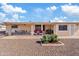 Spacious covered patio with tile flooring, ceiling fan, and outdoor seating, overlooking the desert landscaped backyard at 6237 E Boston St, Mesa, AZ 85205