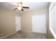 Bedroom with ceiling fan, closet, and natural light from window for a cozy and inviting atmosphere at 7151 W Lamar Rd, Glendale, AZ 85303