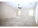 Generously sized bedroom featuring neutral walls and ample natural light from the large windows at 7151 W Lamar Rd, Glendale, AZ 85303