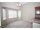 Dining area with bay window, neutral colors and chandelier for ambiance and abundant light at 7151 W Lamar Rd, Glendale, AZ 85303