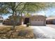 Charming single-story home features a well-maintained front yard, mature landscaping, and a two-car garage at 7151 W Lamar Rd, Glendale, AZ 85303