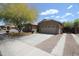 A well-manicured lawn complements this home's attractive architecture and convenient two-car garage at 7151 W Lamar Rd, Glendale, AZ 85303