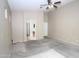 Spacious living room with neutral carpet and a ceiling fan, offering a view into another room at 7151 W Lamar Rd, Glendale, AZ 85303