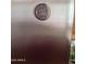 Close up of a stainless steel General Electric refrigerator, a sleek kitchen appliance at 7521 S College Ave, Tempe, AZ 85283