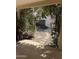 Outdoor backyard features a spiral staircase, greenery, decorative rocks, and a shed at 7521 S College Ave, Tempe, AZ 85283