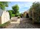 Backyard showcases desert landscaping, storage shed and spiral staircase at 7521 S College Ave, Tempe, AZ 85283