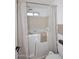 Accessible walk-in tub featuring shower head at 7521 S College Ave, Tempe, AZ 85283