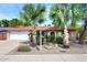 Charming single-story home with a two-car garage, well-maintained lawn and desert landscaping at 7521 S College Ave, Tempe, AZ 85283