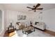 Bright living room featuring neutral furniture, ceiling fan, and stylish decor at 7521 S College Ave, Tempe, AZ 85283