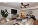 Spacious open-concept living space featuring a media center, console table, and modern decor at 7521 S College Ave, Tempe, AZ 85283