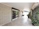 Covered patio area showcases brick walls and outdoor greenery at 7521 S College Ave, Tempe, AZ 85283