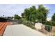 This rooftop patio offers a view of the neighborhood, a storage shed, and mature trees at 7521 S College Ave, Tempe, AZ 85283