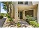 Charming condo entrance with secure black iron door, desert landscaping, and clearly marked unit number at 7700 E Gainey Ranch Rd # 124, Scottsdale, AZ 85258