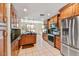 Well-equipped kitchen with stainless steel appliances, wood cabinets, and sleek countertops at 7700 E Gainey Ranch Rd # 124, Scottsdale, AZ 85258