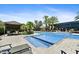 Resort-style pool and spa with a covered seating area and mature landscaping at 7700 E Gainey Ranch Rd # 124, Scottsdale, AZ 85258