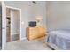 Bedroom boasts lots of natural light and neutral colors, complemented by light wood furniture at 8207 W Planada Ln, Peoria, AZ 85383