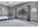 Serene bedroom featuring plush carpeting, a large window with peaceful views, and a soothing color palette at 8207 W Planada Ln, Peoria, AZ 85383
