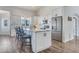 Bright kitchen features white cabinetry, stainless steel appliances, and a large island at 8207 W Planada Ln, Peoria, AZ 85383