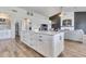 Bright, open kitchen features a large island with granite countertops, plenty of cabinet space, and modern appliances at 8207 W Planada Ln, Peoria, AZ 85383