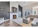 Inviting living room showcasing a cozy fireplace, plush seating, and elegant decor, perfect for relaxation and entertaining at 8207 W Planada Ln, Peoria, AZ 85383