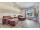 Comfortable living room with vaulted ceiling, wood-look floors and comfortable seating at 8207 W Planada Ln, Peoria, AZ 85383