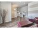 Open-concept living area with wood-look floors and ample natural light throughout at 8207 W Planada Ln, Peoria, AZ 85383