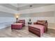 Comfortable living room with vaulted ceiling, wood-look floors and comfortable seating at 8207 W Planada Ln, Peoria, AZ 85383