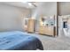 Bright main bedroom with neutral walls, plush carpet and a large dresser at 8207 W Planada Ln, Peoria, AZ 85383