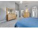 Spacious main bedroom features neutral walls, plush carpet, and a large dresser at 8207 W Planada Ln, Peoria, AZ 85383