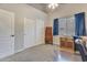 Bright office space featuring sliding closet doors and built in desk and drawer storage at 8207 W Planada Ln, Peoria, AZ 85383