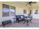 Covered patio with outdoor furniture, ceiling fan and backyard views at 8207 W Planada Ln, Peoria, AZ 85383