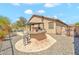 Backyard oasis featuring an outdoor kitchen, shaded patio, and low-maintenance landscaping at 8465 W Andrea Dr, Peoria, AZ 85383