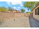 Low-maintenance backyard with desert landscaping and brick perimeter wall for privacy at 8465 W Andrea Dr, Peoria, AZ 85383