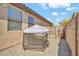 Backyard view of a metal frame dog kennel sitting on top of rock ground cover at 8465 W Andrea Dr, Peoria, AZ 85383