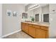 Bathroom with double sink vanity and tile flooring at 8465 W Andrea Dr, Peoria, AZ 85383