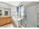 Bright bathroom featuring a tub, shower, vanity with mirror, and tile flooring at 8465 W Andrea Dr, Peoria, AZ 85383