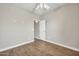 Bright bedroom with wood-look floors, neutral walls, and a ceiling fan at 8465 W Andrea Dr, Peoria, AZ 85383