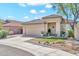 Charming single-story home boasting a tile roof, desert landscaping, and a spacious two-car garage at 8465 W Andrea Dr, Peoria, AZ 85383