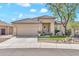 Charming home featuring a tile roof, desert landscaping, and a two-car garage at 8465 W Andrea Dr, Peoria, AZ 85383