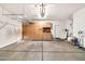 Spacious garage with ample storage cabinets and shelving units installed at 8465 W Andrea Dr, Peoria, AZ 85383